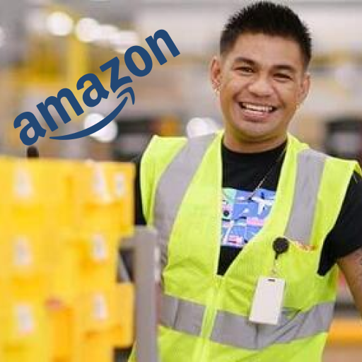 A smiling man in a bright yellow vest with the amazon warehouse in the background